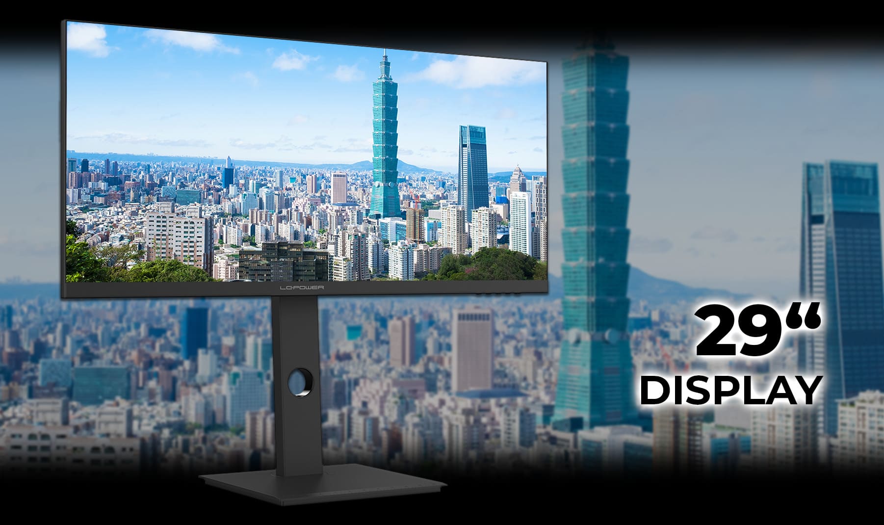 LC-M29-UW-UXGA-75 Monitor mit 29 Zoll und einem Ueberblick über eine Großstadt als Hintergrund